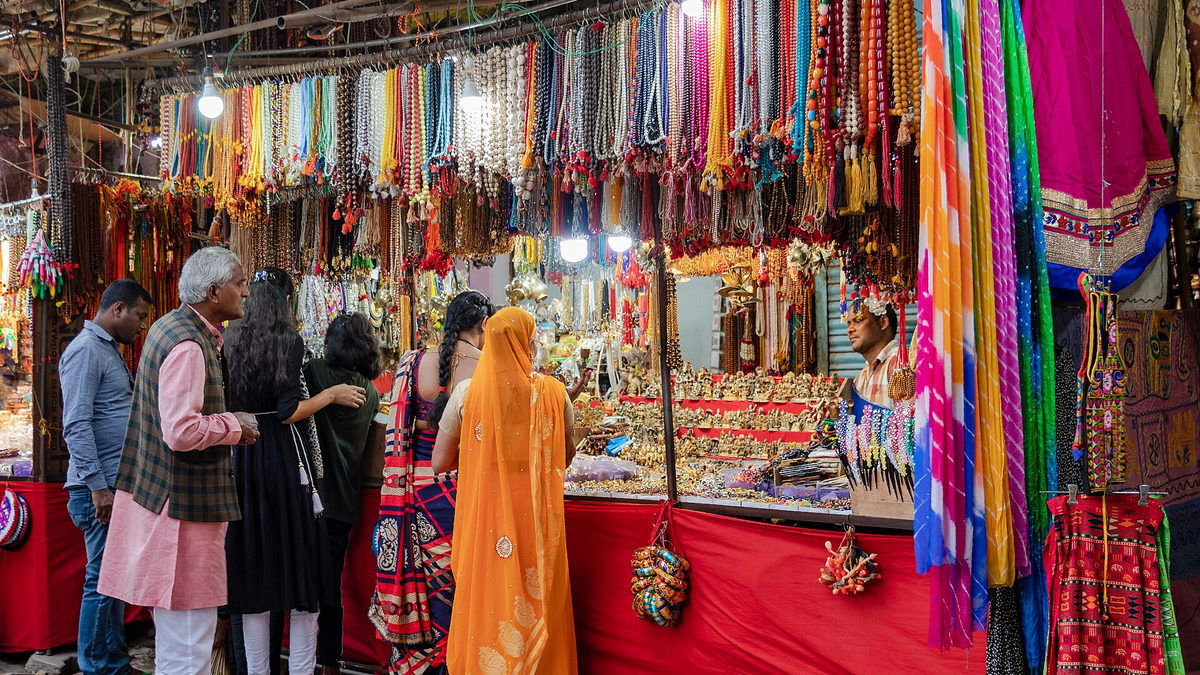 Three generations of a family at a bazaar stall in Pushkar