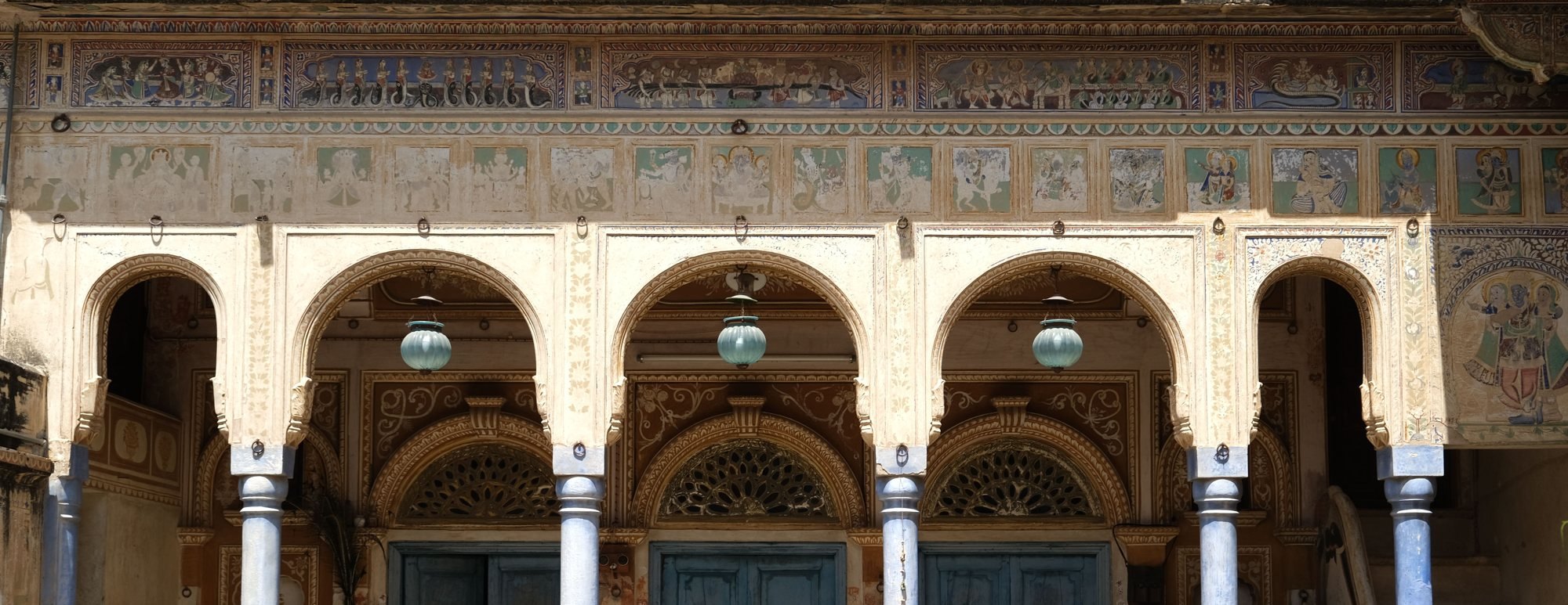 Painted frescoes above the arcade of a haveli in Mandawa, Shekhawati